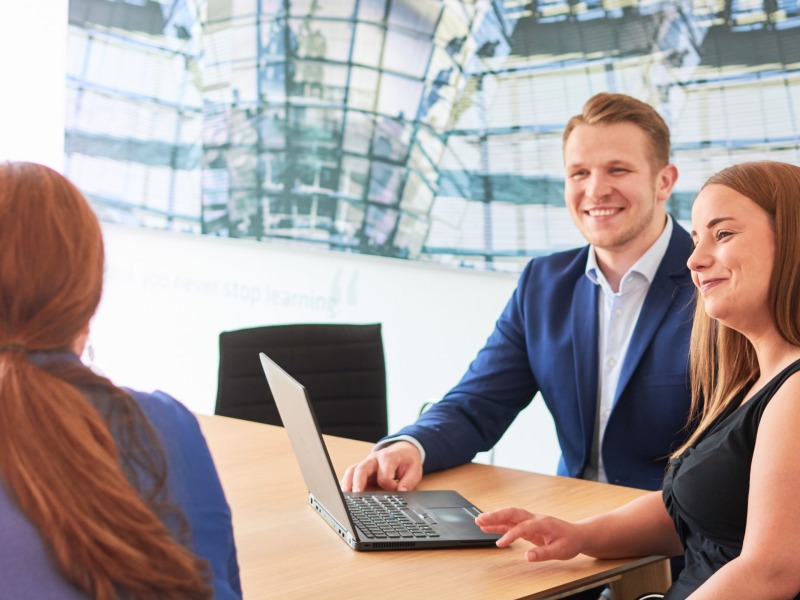 Employees during a client consultation