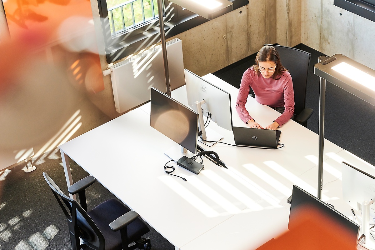 Employees workin at a desk